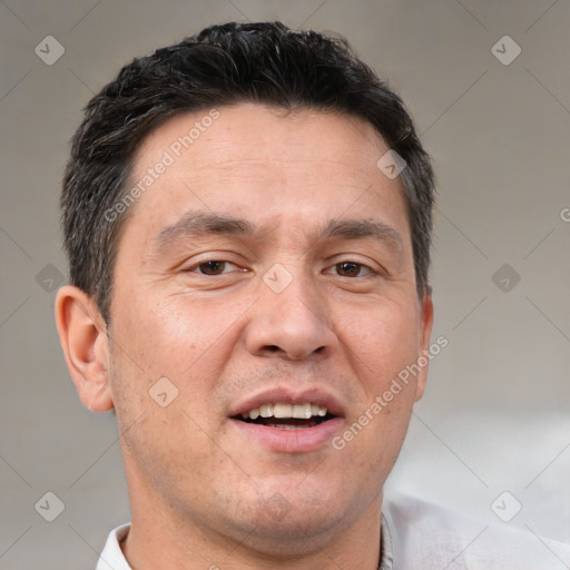 Joyful white adult male with short  brown hair and brown eyes