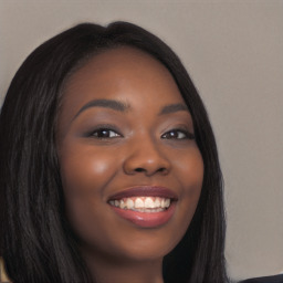 Joyful black young-adult female with long  brown hair and brown eyes