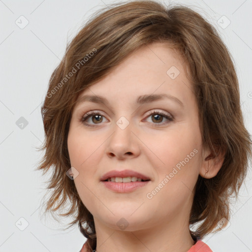 Joyful white young-adult female with medium  brown hair and blue eyes