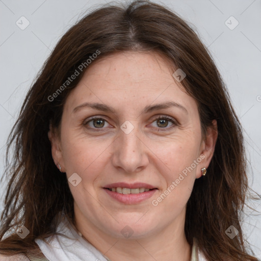 Joyful white adult female with medium  brown hair and grey eyes