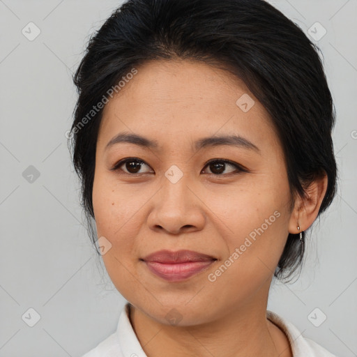 Joyful asian adult female with medium  brown hair and brown eyes