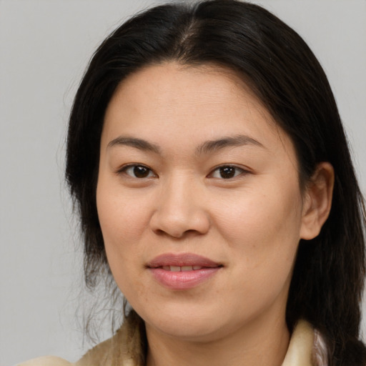 Joyful asian young-adult female with medium  brown hair and brown eyes