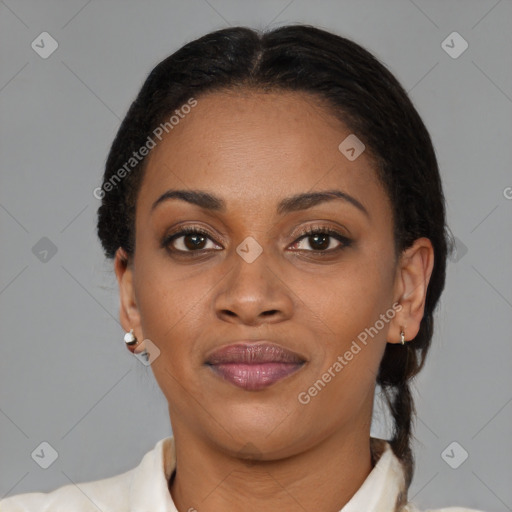 Joyful black young-adult female with short  brown hair and brown eyes