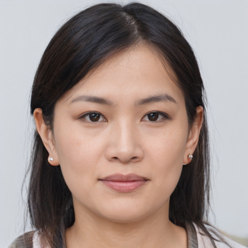 Joyful asian young-adult female with medium  brown hair and brown eyes