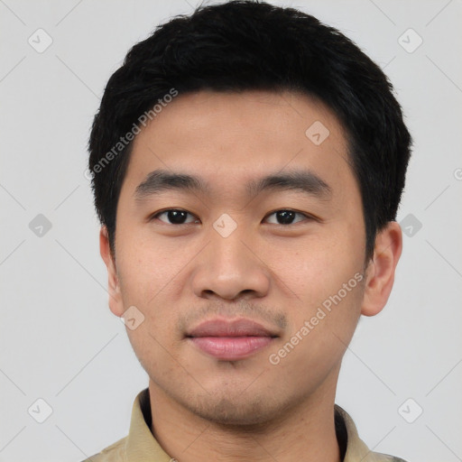 Joyful asian young-adult male with short  black hair and brown eyes