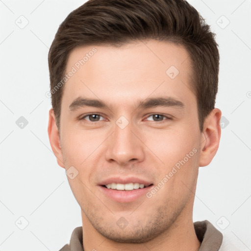 Joyful white young-adult male with short  brown hair and brown eyes