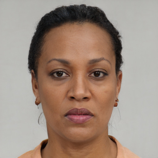 Neutral black adult female with short  brown hair and brown eyes
