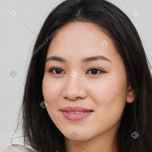 Joyful asian young-adult female with long  brown hair and brown eyes