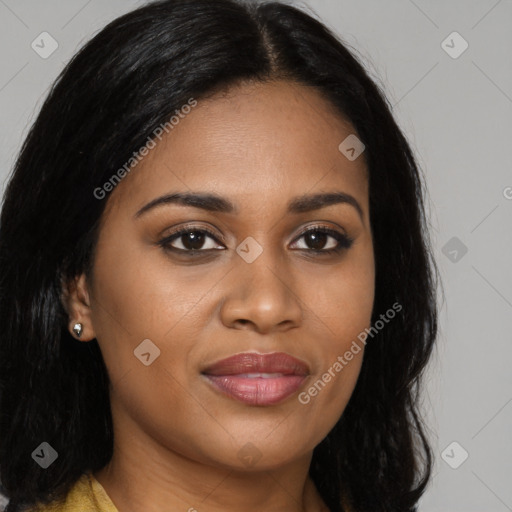 Joyful black young-adult female with long  brown hair and brown eyes