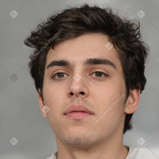 Neutral white young-adult male with short  brown hair and brown eyes