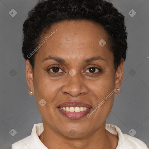 Joyful black adult female with short  brown hair and brown eyes