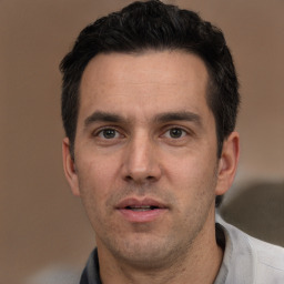 Neutral white adult male with short  black hair and brown eyes