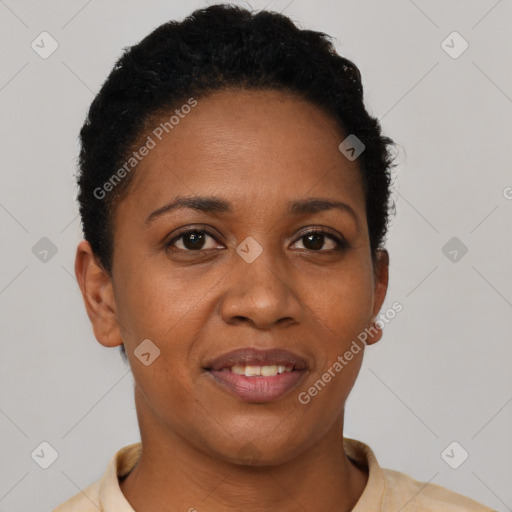 Joyful black young-adult female with short  brown hair and brown eyes