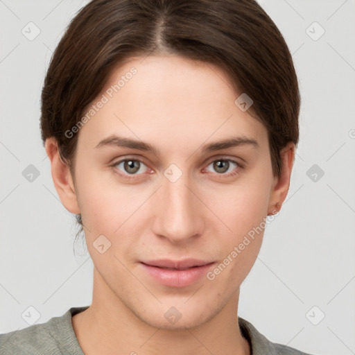 Joyful white young-adult female with short  brown hair and grey eyes