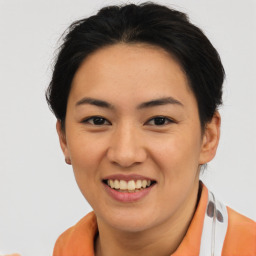 Joyful asian young-adult female with short  brown hair and brown eyes