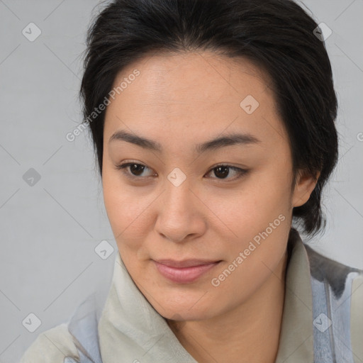 Joyful asian young-adult female with medium  brown hair and brown eyes