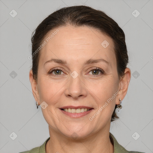 Joyful white adult female with short  brown hair and grey eyes