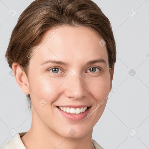 Joyful white young-adult female with short  brown hair and grey eyes