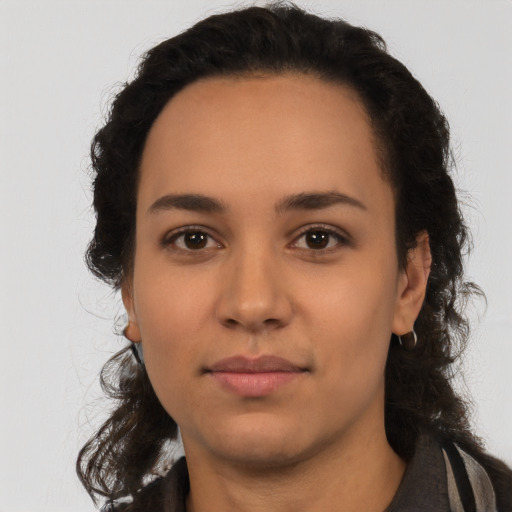Neutral latino young-adult female with long  black hair and brown eyes