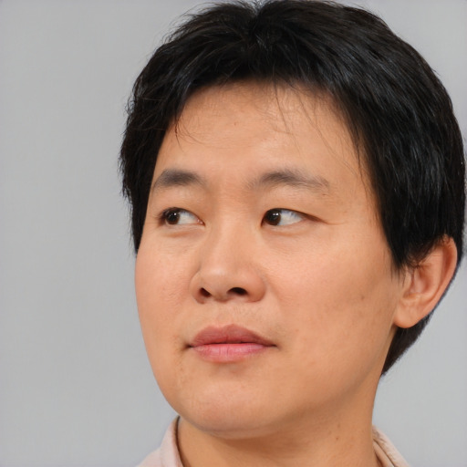 Neutral asian young-adult male with short  brown hair and brown eyes