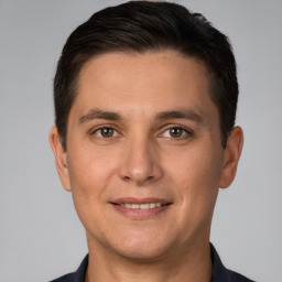 Joyful white young-adult male with short  brown hair and brown eyes