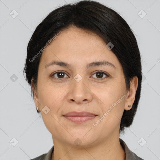 Joyful white adult female with medium  brown hair and brown eyes