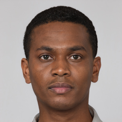 Neutral black young-adult male with short  brown hair and brown eyes