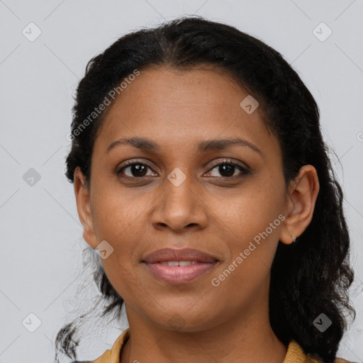 Joyful black young-adult female with medium  brown hair and brown eyes