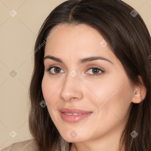 Joyful white young-adult female with long  brown hair and brown eyes