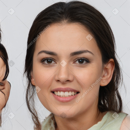 Joyful latino young-adult female with medium  brown hair and brown eyes