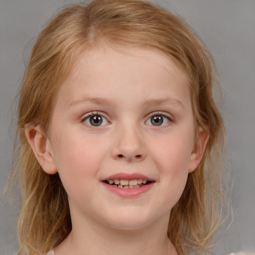 Joyful white child female with medium  brown hair and blue eyes