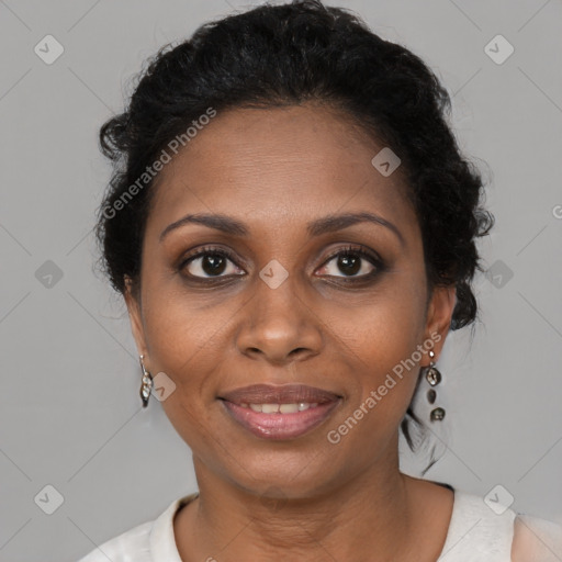 Joyful black adult female with short  brown hair and brown eyes