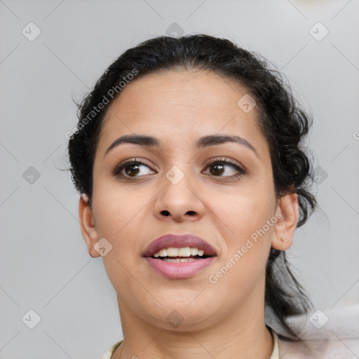 Joyful latino young-adult female with medium  brown hair and brown eyes