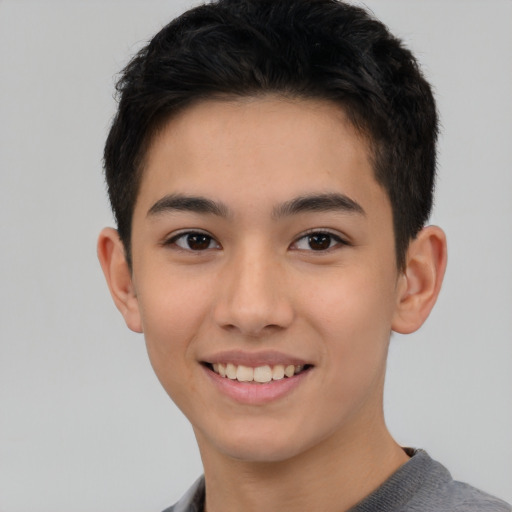 Joyful asian young-adult male with short  black hair and brown eyes