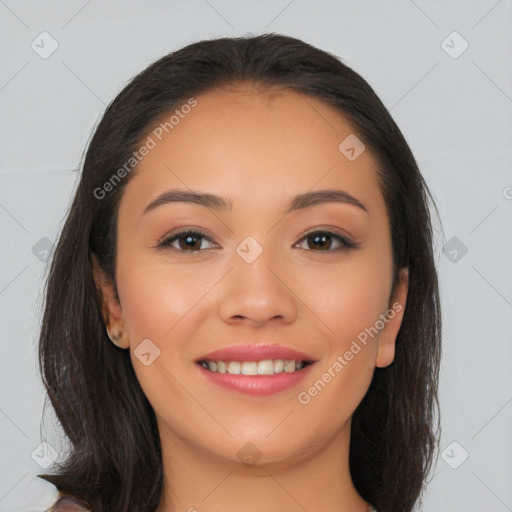 Joyful latino young-adult female with long  brown hair and brown eyes