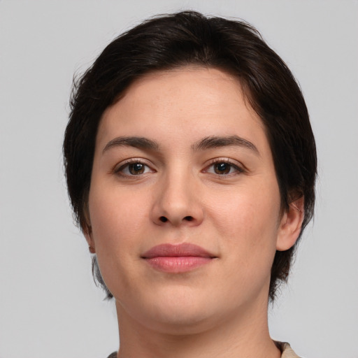 Joyful white young-adult female with medium  brown hair and brown eyes