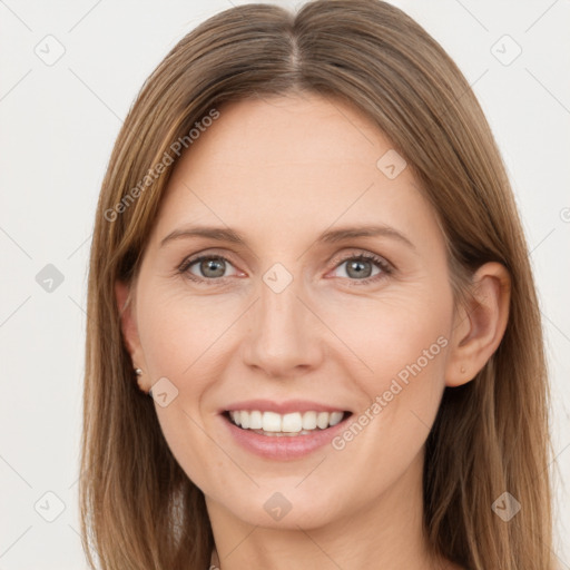 Joyful white young-adult female with long  brown hair and grey eyes