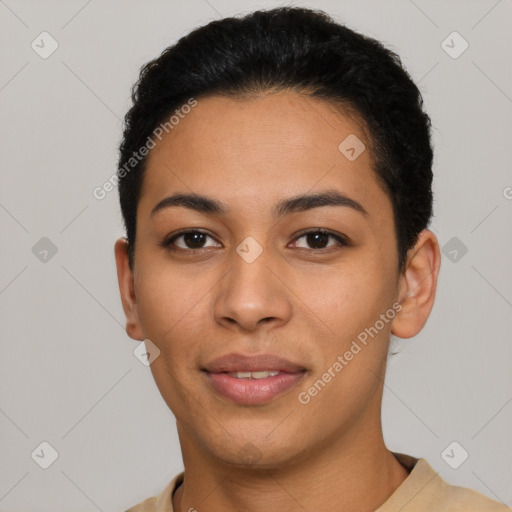 Joyful latino young-adult female with short  black hair and brown eyes