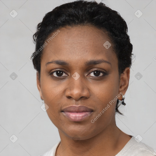 Joyful black young-adult female with short  black hair and brown eyes