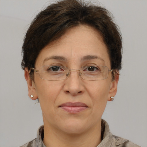 Joyful white adult female with short  brown hair and brown eyes