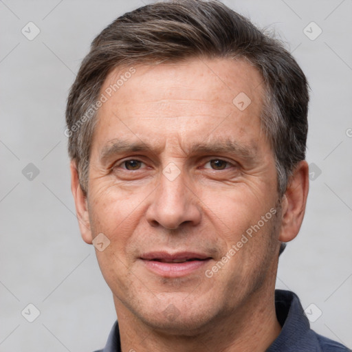 Joyful white adult male with short  brown hair and brown eyes