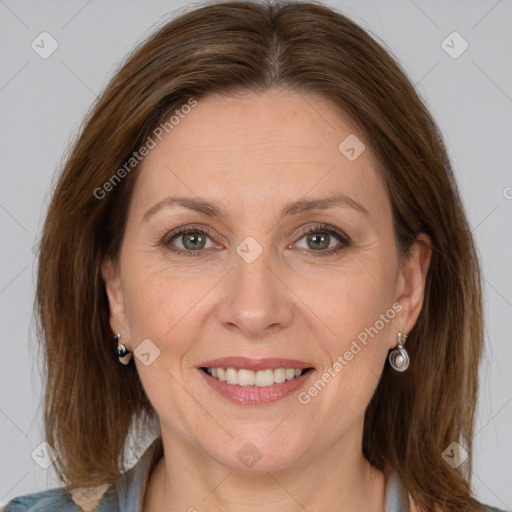 Joyful white adult female with medium  brown hair and grey eyes