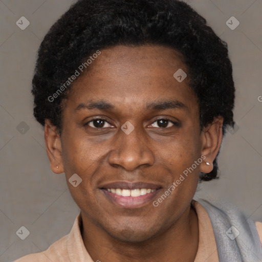 Joyful black young-adult male with short  brown hair and brown eyes