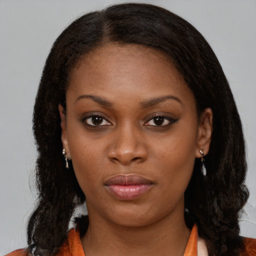 Neutral black young-adult female with long  brown hair and brown eyes