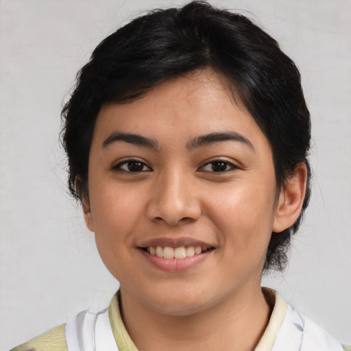 Joyful latino young-adult female with medium  black hair and brown eyes