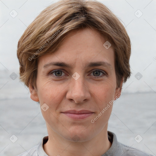 Joyful white adult female with short  brown hair and grey eyes