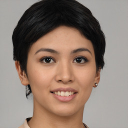 Joyful asian young-adult female with short  black hair and brown eyes