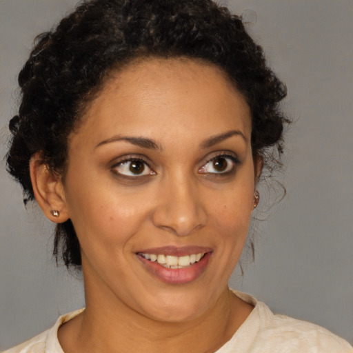 Joyful white young-adult female with medium  brown hair and brown eyes