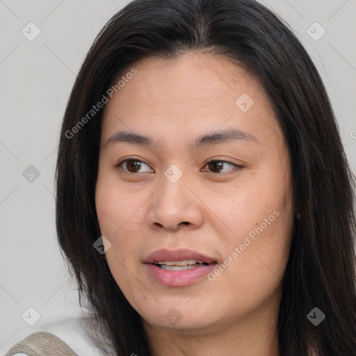 Joyful asian young-adult female with long  brown hair and brown eyes