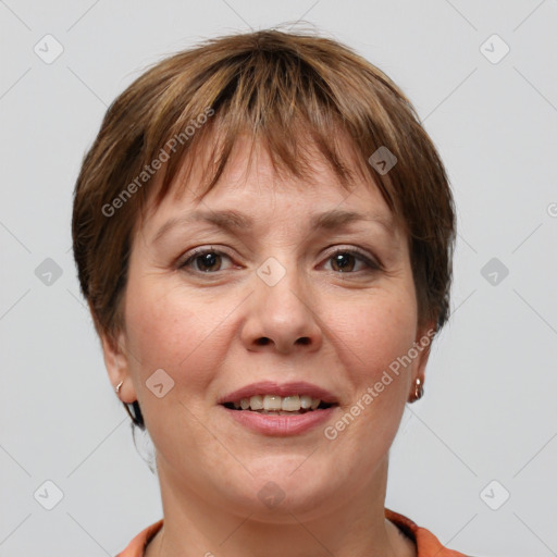 Joyful white adult female with short  brown hair and grey eyes